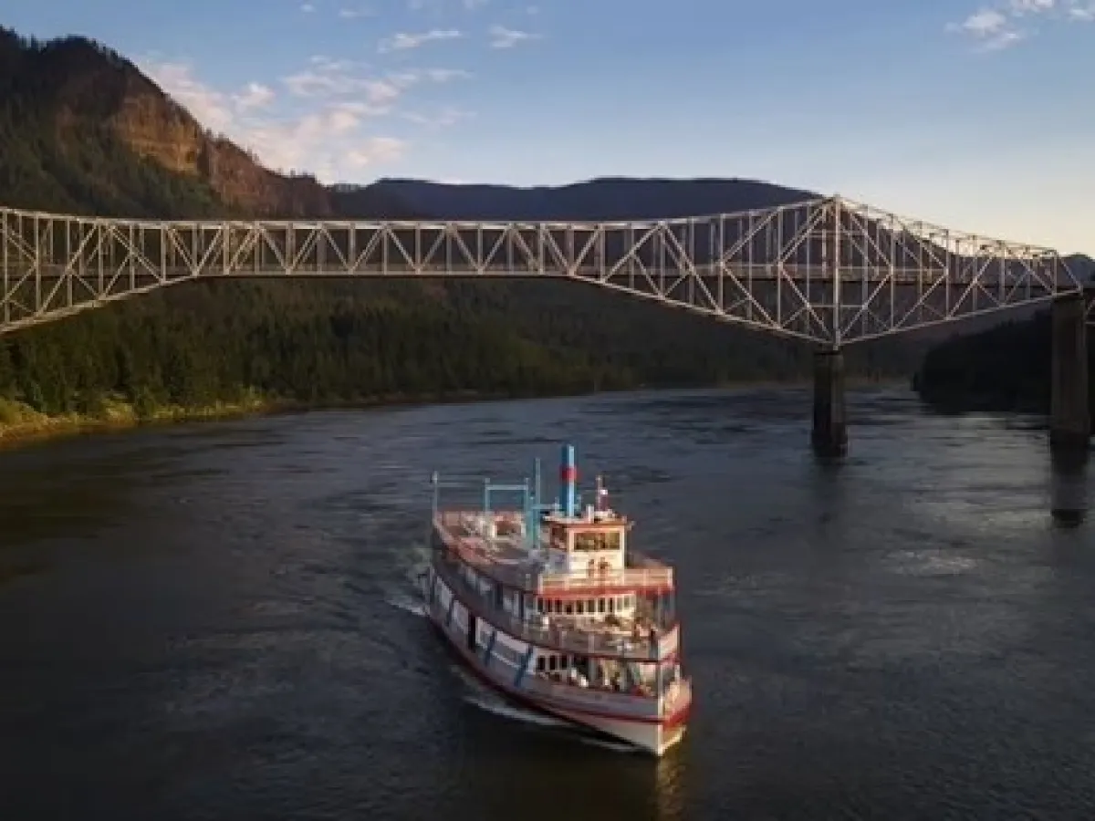 a train crossing a bridge over a body of water