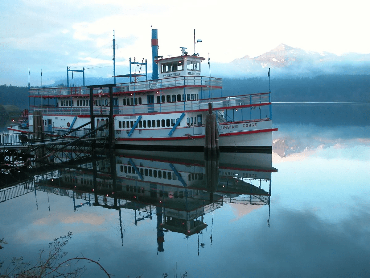a boat is docked next to a body of water