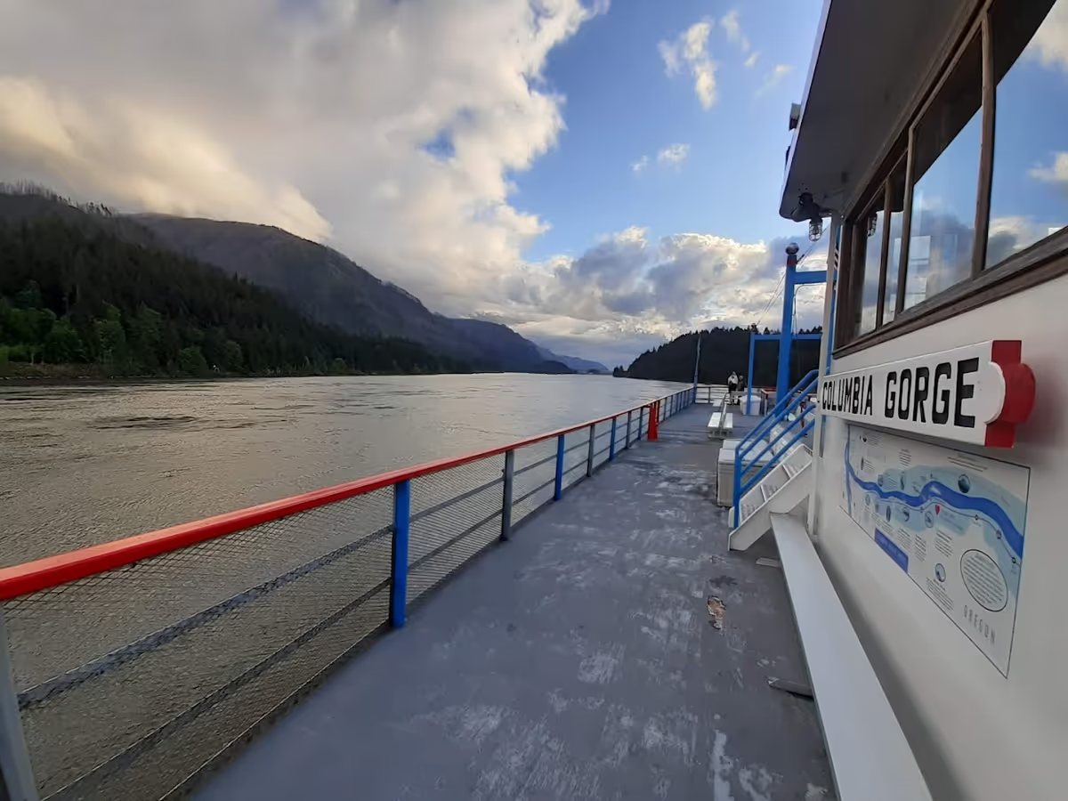 a boat is docked next to a body of water